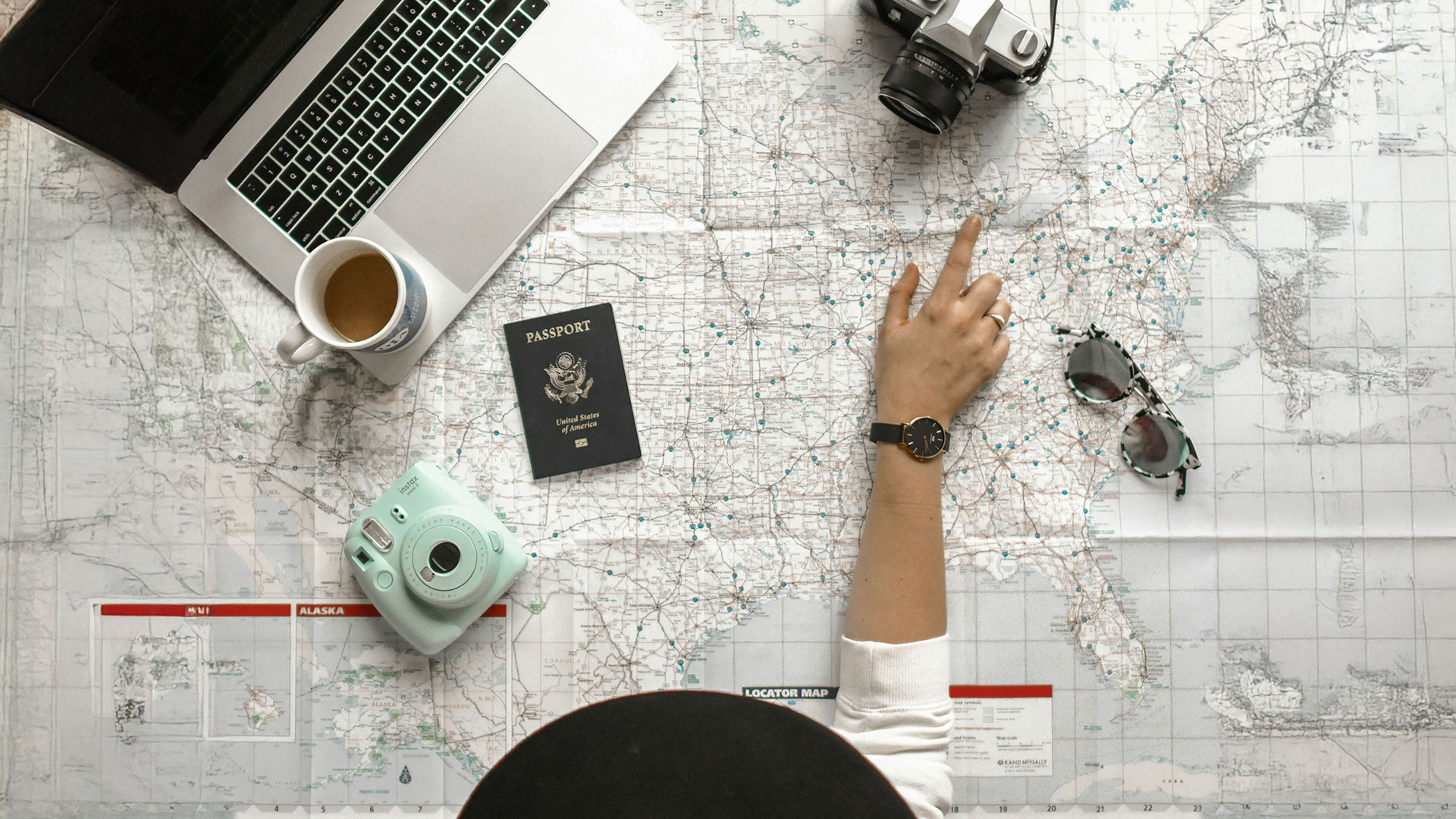 travel advisor woman laptop map planning